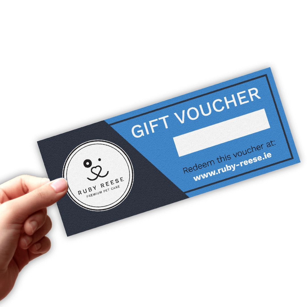 A hand is holding a blank RUBY REESE gift voucher