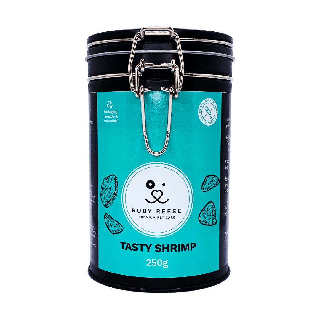 A black tin of RUBY REESE TASTY SHRIMP natural dog treats with an turquoise label